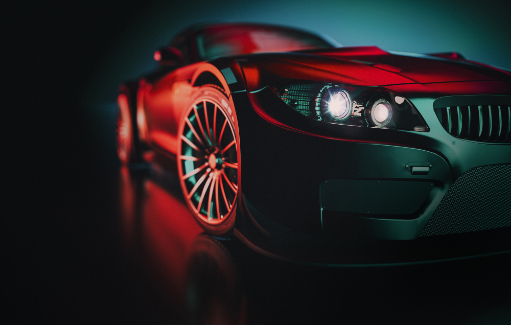 Foto eines edlen Sportautos mit rotem Lichteinfall.